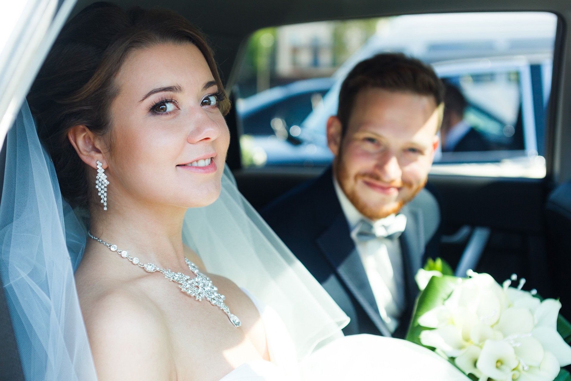 Just married couple in a car